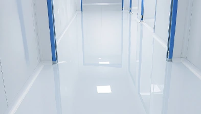 Glossy white epoxy floor in a clean factory corridor
