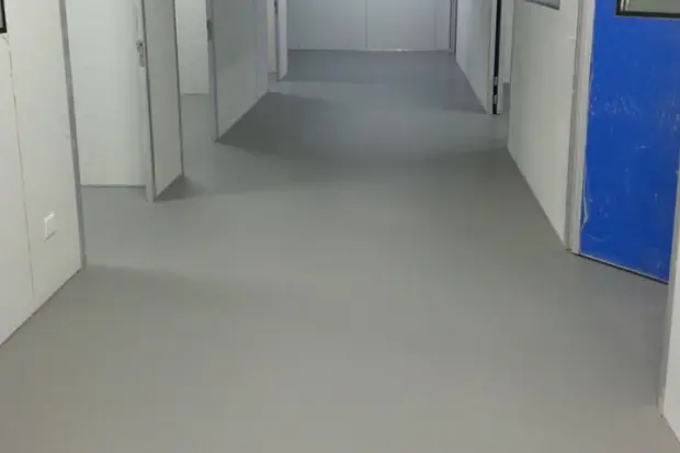 Seamless grey floor in a pharmaceutical clean corridor