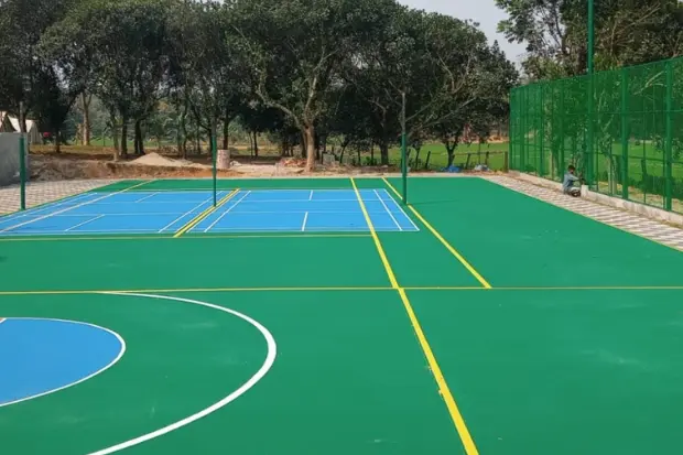 Green and blue acrylic sports court with painted lines